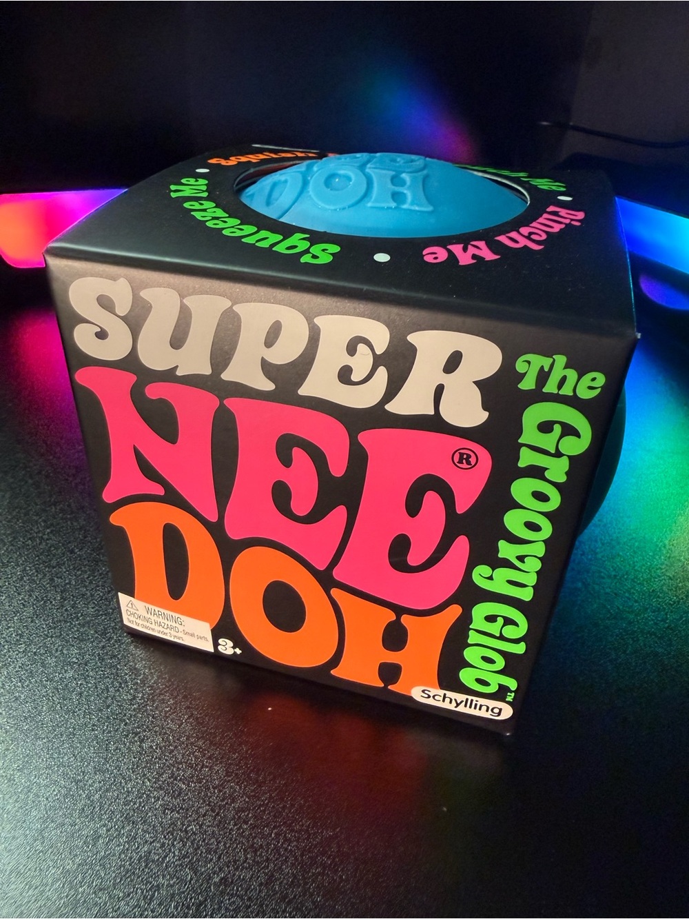 Super NeeDoh Groovy Glo Blue Squeeze Toy by Schylling